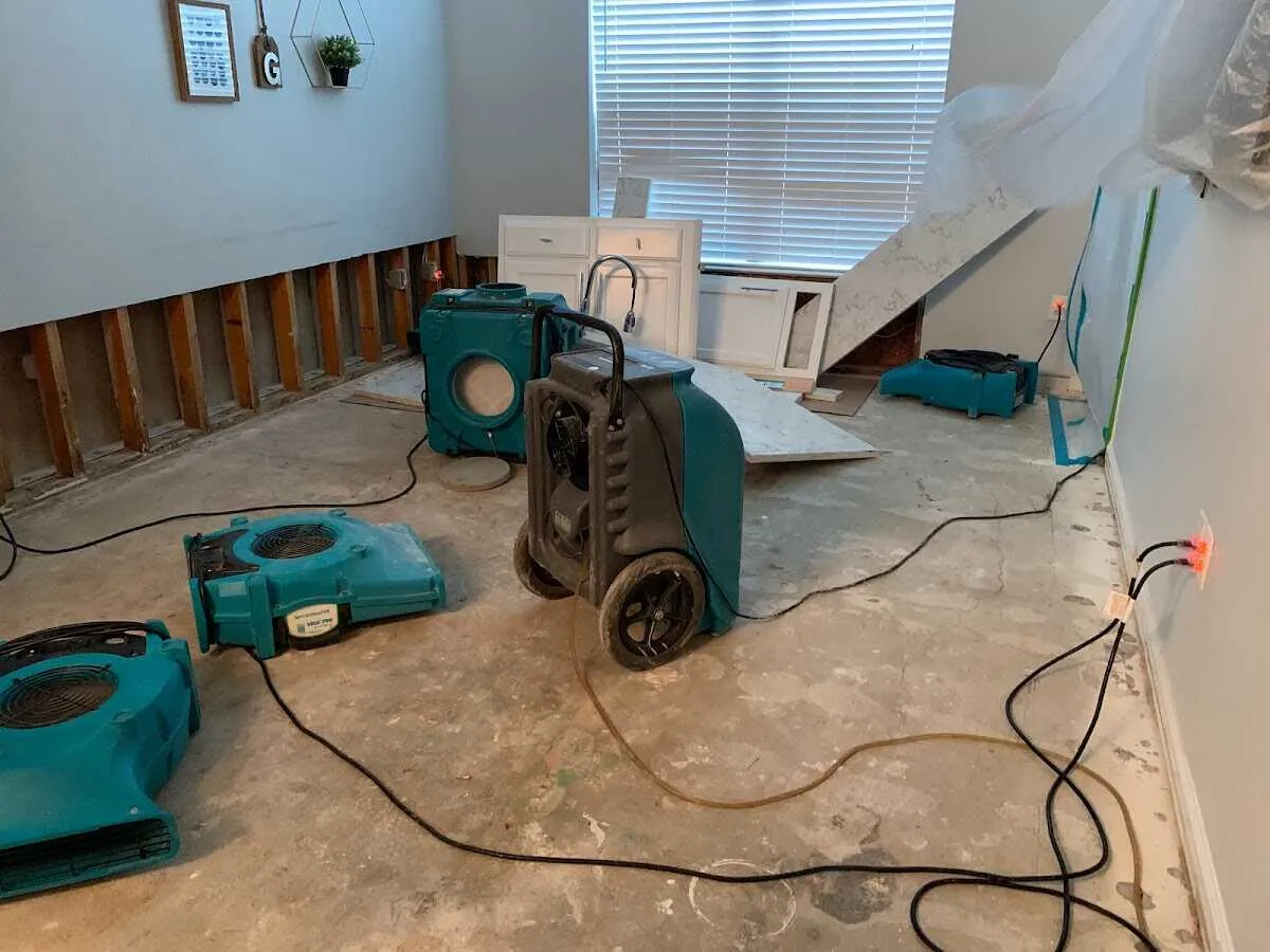 Dehumidifier in flood-cut room for Water Damage Restoration in Harris